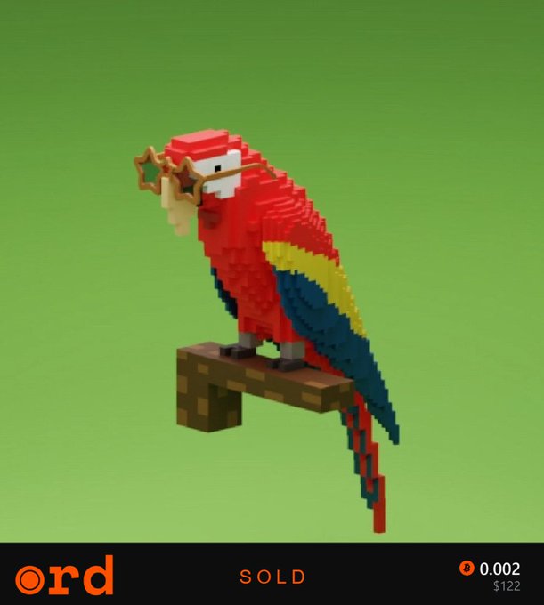 The image features a red, yellow, blue, and green bird sitting on top of a wooden block or shelf. The bird has a pair of glasses on its face and appears to be wearing a crown. The background of the image is a solid green color with some white text visible in the bottom right corner. The post reads "SOLD" followed by an image of the bird, which is a small, detailed replica of a parrot.