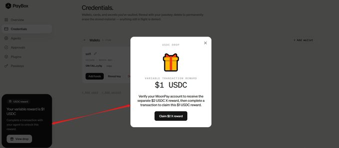A screenshot of a PayBox wallet interface showing a USDC drop pop-up offering a $1 USDC reward for completing a transaction, with a red arrow pointing to the claim button.