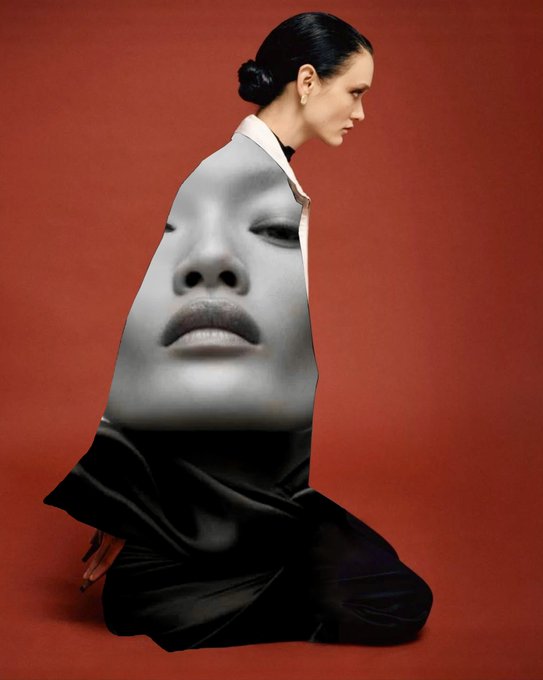 A fashion editorial image shows a woman in profile wearing a garment printed with a large black-and-white face, set against a deep red background.