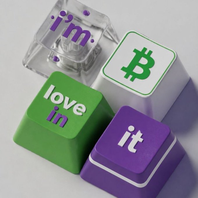 3D-rendered keyboard keys with text 'i'm', 'love', 'in', and 'it' alongside a key featuring the Bitcoin logo, spelling out 'i'm love in it' with Bitcoin.
