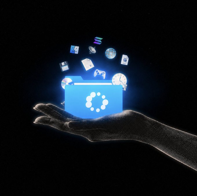 The image features a hand holding an open blue folder filled with various icons, including a clock, a book, a keyboard, and other icons representing different types of technology. The hand is positioned over a black background, which highlights the vibrant colors of the folder's contents. The image also includes text that reads "market may be cooked but creators never stop showing up looking for Solana native creators to join the mission and help spread the motion across Solana who'S in?". This message suggests that there might be an ongoing effort to find and include more creators from the Solana community, possibly as part of a larger project or initiative.