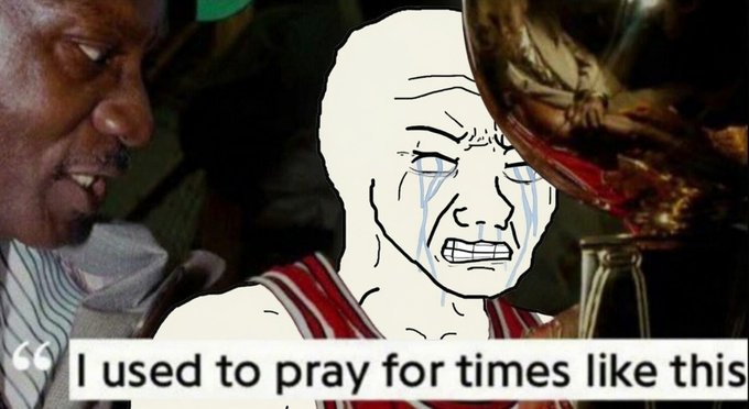 The image features a man with a sad expression, possibly crying or frowning, as he looks at something behind him. There are two people present in the scene - one person who appears to be a basketball player wearing a red shirt, and another individual standing next to them. The background of the image is blurred, making it difficult to determine what exactly they are looking at.