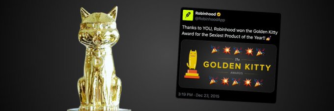 A golden cat trophy sits next to a tweet from @RobinhoodApp dated Dec 23, 2015, announcing "Robinhood won the Golden Kitty Award for the Sexiest Product of the Year!!" — referencing the original Product Hunt award that inspired the meme coin $GOLDEN.