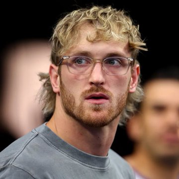 A blonde-haired man with glasses and a mullet looks off to the side, his expression appearing contemplative. The image, paired with a post criticizing NFT trading during the pandemic, suggests the subject may be associated with the NFT or crypto world, with the post using the context to mock the speculative bubble of that era.