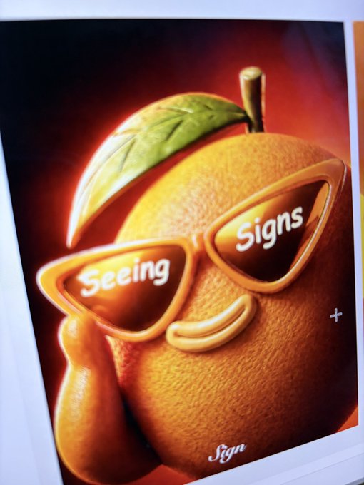 An anthropomorphic orange wearing sunglasses labeled "Seeing" and "Signs" strikes a cool pose. Fitting for a "gm" post, the character is cheerfully "seeing signs" of a great morning ahead.