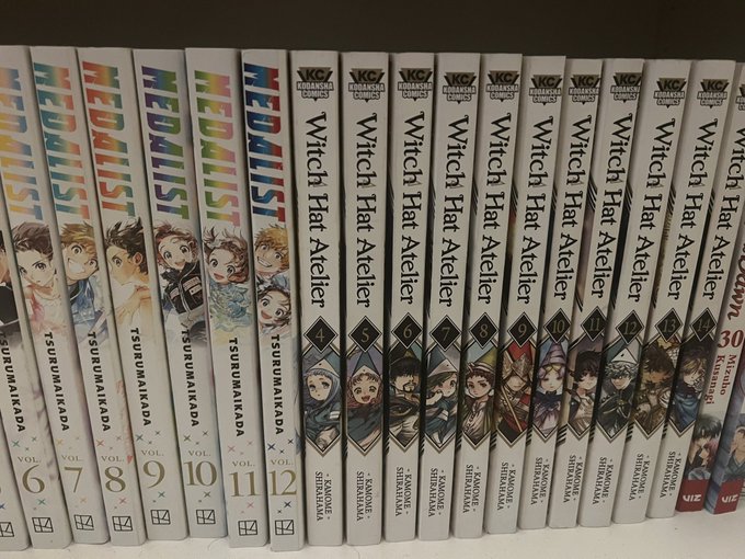 A bookshelf displays manga volumes of "Medalist" (Volumes 6-12) by Tsurumaikada alongside volumes 1-30 of "Witch Hat Atelier" by Kamome Shirahama. The image appears to showcase the reader's manga collection, with the caption "I contributed to that 9 million WOO" suggesting their purchases contributed to the sales milestone of Witch Hat Atelier.