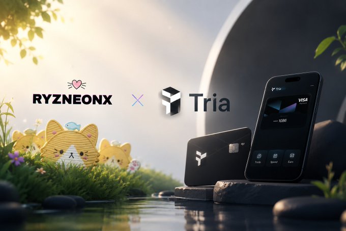 The image features a cell phone with a cryptocurrency wallet app displayed, along with two cute cartoon cats sitting next to each other. The background of the image includes a river surrounded by rocks and trees. The text at the bottom of the image reads "Good Meawrning 𝕏 ᯓ Most crypto cards make you sell early. You convert to fiat and wait. That’s not real utility. @useTria works different. ᯓAnd in one".