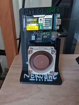 Custom DIY portable electronic device labeled 'NEKORG' with a screen showing '106.6' and 'BEER', featuring a large circular dial.
