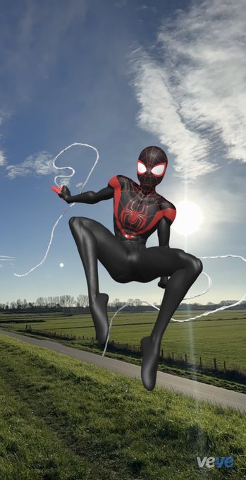 A 3D rendering shows Miles Morales Spider-Man in a black and red suit posing in mid-air against a blue sky, with a 'veye' watermark in the corner.