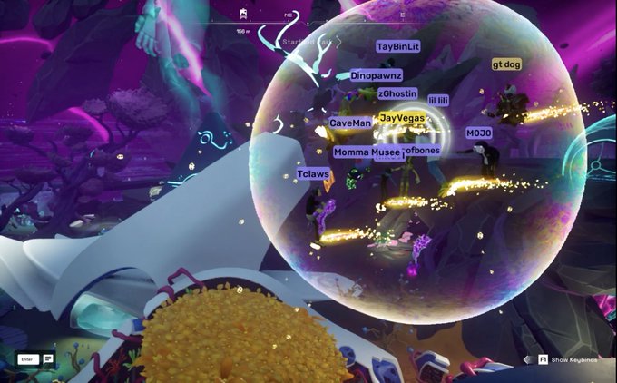 A screenshot from a colorful underwater game (appears to be Webbed) showing multiple player names clustered in a transparent bubble including 'TayBinLit', 'Dinopawnz', 'zGhostin', 'JayVegas', 'CaveMan', 'MommaMuse', 'ofbones', 'gt dog', 'MOJO', and 'Tclaws', with a burrito-like food item in the foreground.