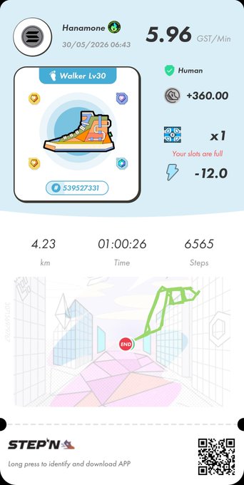 The image features a smartphone screen displaying a map of a city with various buildings, a river, and trees within the scene. The map provides directions for walking through the area using a red and green stop sign symbol. This image seems to be related to a step tracking app that encourages physical activity by providing a route with landmarks along the way. It appears to be from the stepn brand in partnership with StepN.