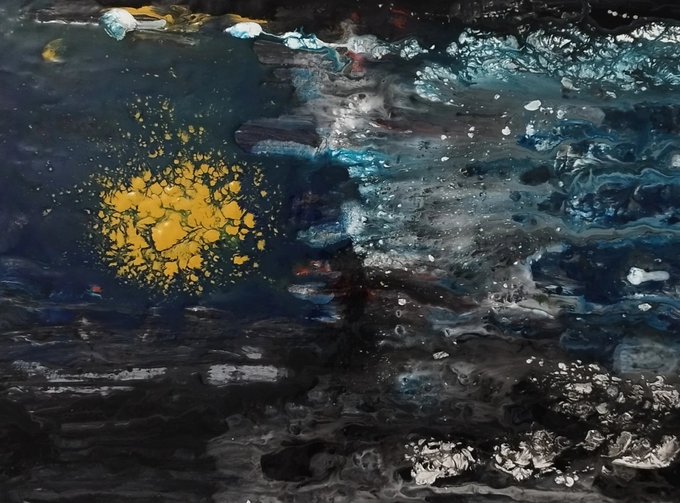 An abstract close-up image showing dark rippling water with a bright yellow patch of floating material or oil on the left side and bubbly texture on the right.