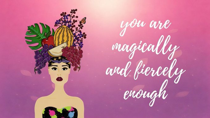 An illustration shows a woman with a colorful fruit headdress next to the inspirational text 'you are magically and fiercely enough' against a pink background.