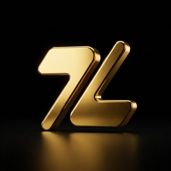 A shiny gold 3D logo with stylized arrow-like letters is rendered against a black background with a reflective surface.