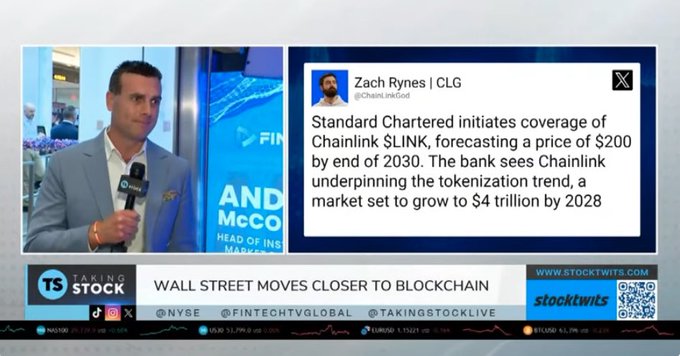A man in a gray suit being interviewed on NYSE's "Taking Stock" segment discusses the headline "WALL STREET MOVES CLOSER TO BLOCKCHAIN," alongside a tweet from Zach Rynes showing Standard Chartered's $200 price forecast for Chainlink ($LINK) by 2030, tied to the tokenization market projected to reach $4 trillion by 2028.