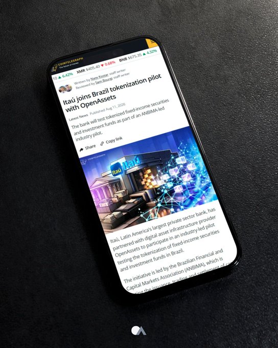 A smartphone displaying a CoinMarketCap article titled 'Itaú joins Brazil tokenization plot with OpenAssets' published August 11, 2025, reviewing an industry-led tokenization initiative.