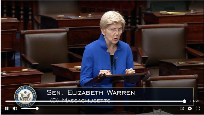 Senator Elizabeth Warren (D-Massachusetts) stands at a podium on the Senate floor, delivering remarks as indicated by the on-screen caption and "LIVE" broadcast marker from the United States Senate.