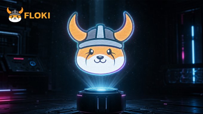 A glowing Floki (FLOKI) crypto logo featuring a Shiba Inu dog wearing a Viking helmet is projected as a hologram from a circular device in a dark, futuristic tech setting, matching the post's "future has a face. And horns. GM Vikings" theme by blending Viking imagery with sci-fi digital aesthetics.