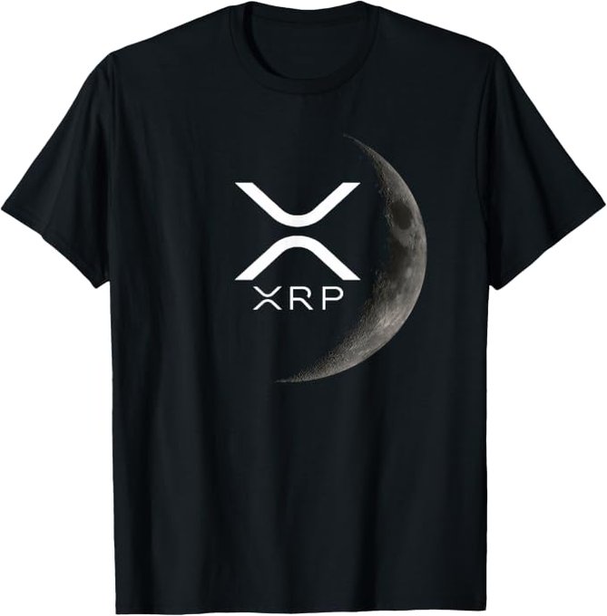 A black t-shirt featuring the XRP cryptocurrency logo alongside a crescent moon graphic, with "XRP" printed beneath the symbol. The image directly supports the post's reference to "XRP stuff is everywhere," showcasing branded XRP merchandise ready to be worn while mowing lawns.