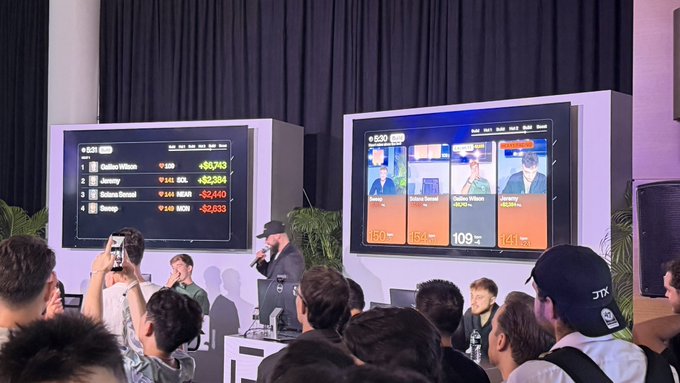 A poker tournament event shows an announcer on stage with large screens displaying player leaderboards and live video feeds, with names like 'Cailee Wilson' and 'Jeremy' visible.