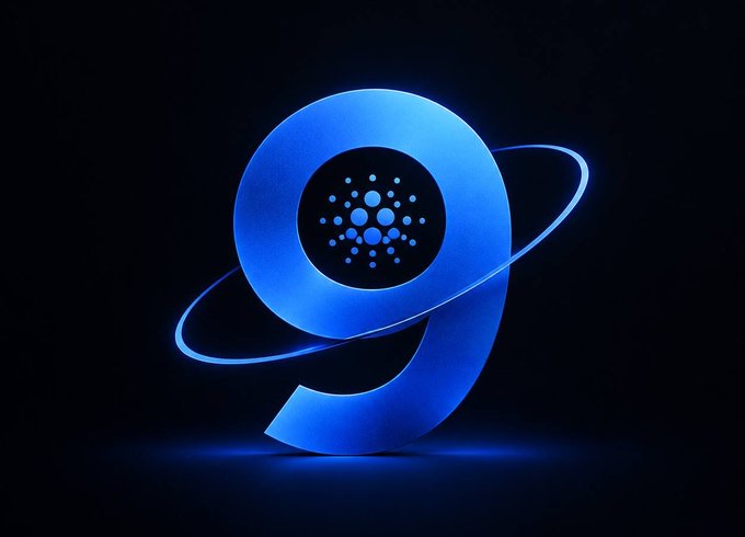 A stylized blue glowing 3D rendering of the Cardano (ADA) cryptocurrency logo on a dark background.