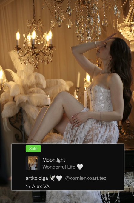 Promotional NFT image of a woman in a white dress sitting in an elegant setting with chandeliers, labeled 'Sale' by artko.olga for the 'Moonlight / Wonderful Life' collection, credit to Alex VA.