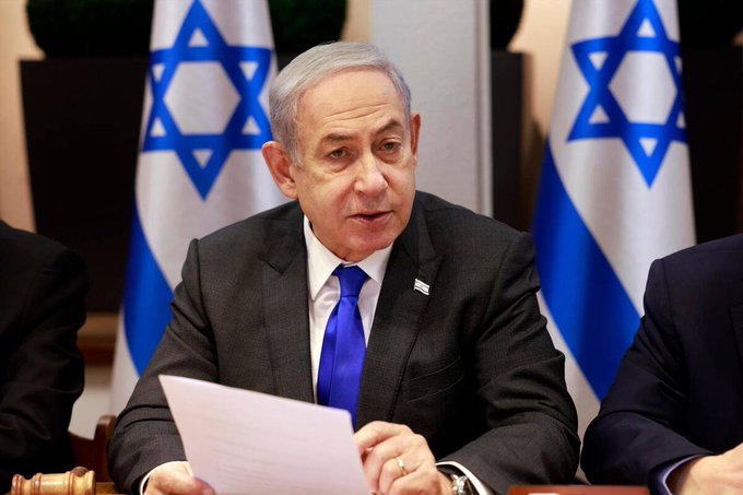 Benjamin Netanyahu, shown here behind the Israeli flag, is listed with 38% odds to win the upcoming October 27, 2026 elections according to Polymarket.