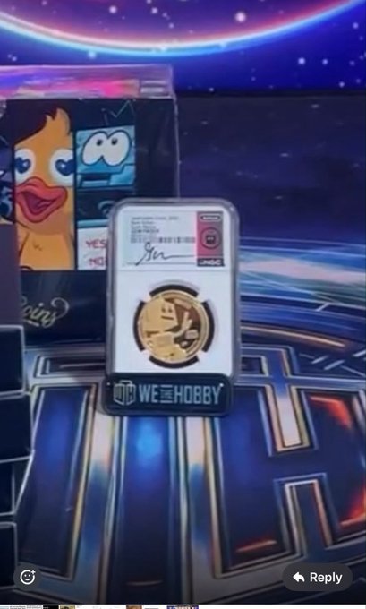 A video screenshot showing a graded Pokémon coin (Eevee) in a WE HOBBY protective case displayed against a blue arcade-themed background.