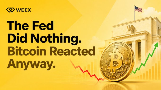 A WEEX promotional graphic featuring a golden Bitcoin coin, the US Federal Reserve building, and the headline 'The Fed Did Nothing. Bitcoin Reacted Anyway.' with red and green trend arrows.