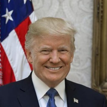 President Donald Trump smiles in a formal portrait, shown wearing a dark suit with a blue tie and an American flag pin, with the U.S. flag visible behind him.

The image relates to the post as it shows President Trump, whose family's crypto businesses are at the center of Democratic demands for ethics provisions in the CLARITY Act.