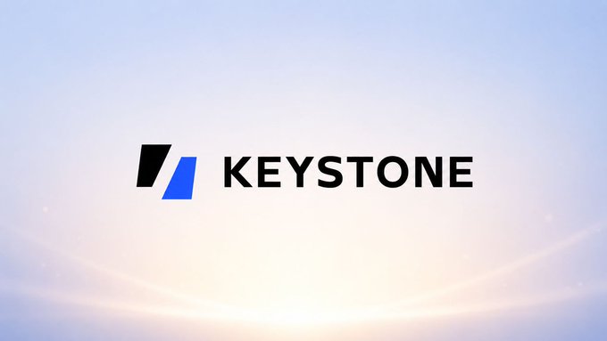The image displays the Keystone logo—featuring a stylized "K" with blue and black diagonal marks—alongside the word "KEYSTONE" in bold black lettering, set against a soft gradient sky background. It serves as a branded visual header for an official statement from Keystone reassuring users of the safety of their hardware wallets, including the Keystone Pro/Essential (Gen 1) and Keystone 3 Pro, highlighting their use of True Random Number Generators (TRNGs) for secure seed phrase generation.