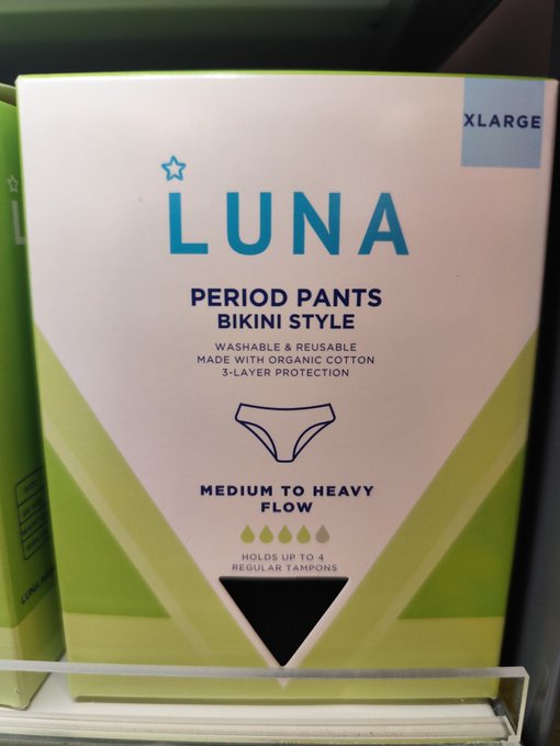 A box of LUNA Period Pants in Bikini Style, XLARGE size, designed for medium to heavy flow and holding up to 4 regular tampons, displayed on a store shelf.