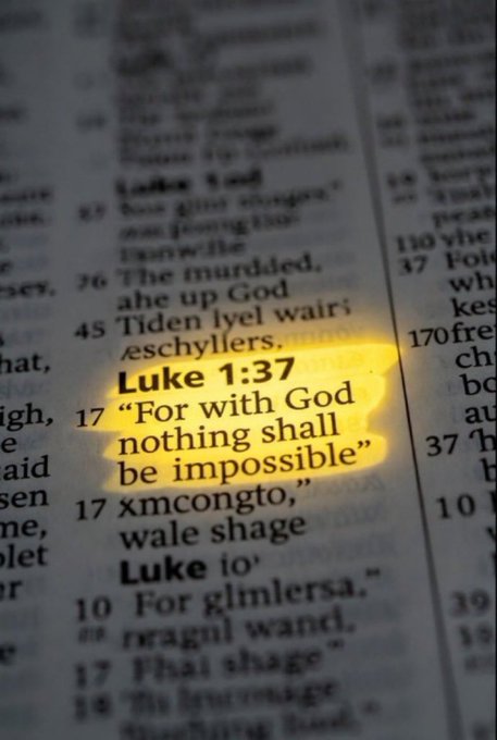 A close-up of a Bible page with Luke 1:37 highlighted in yellow, reading "For with God nothing shall be impossible".