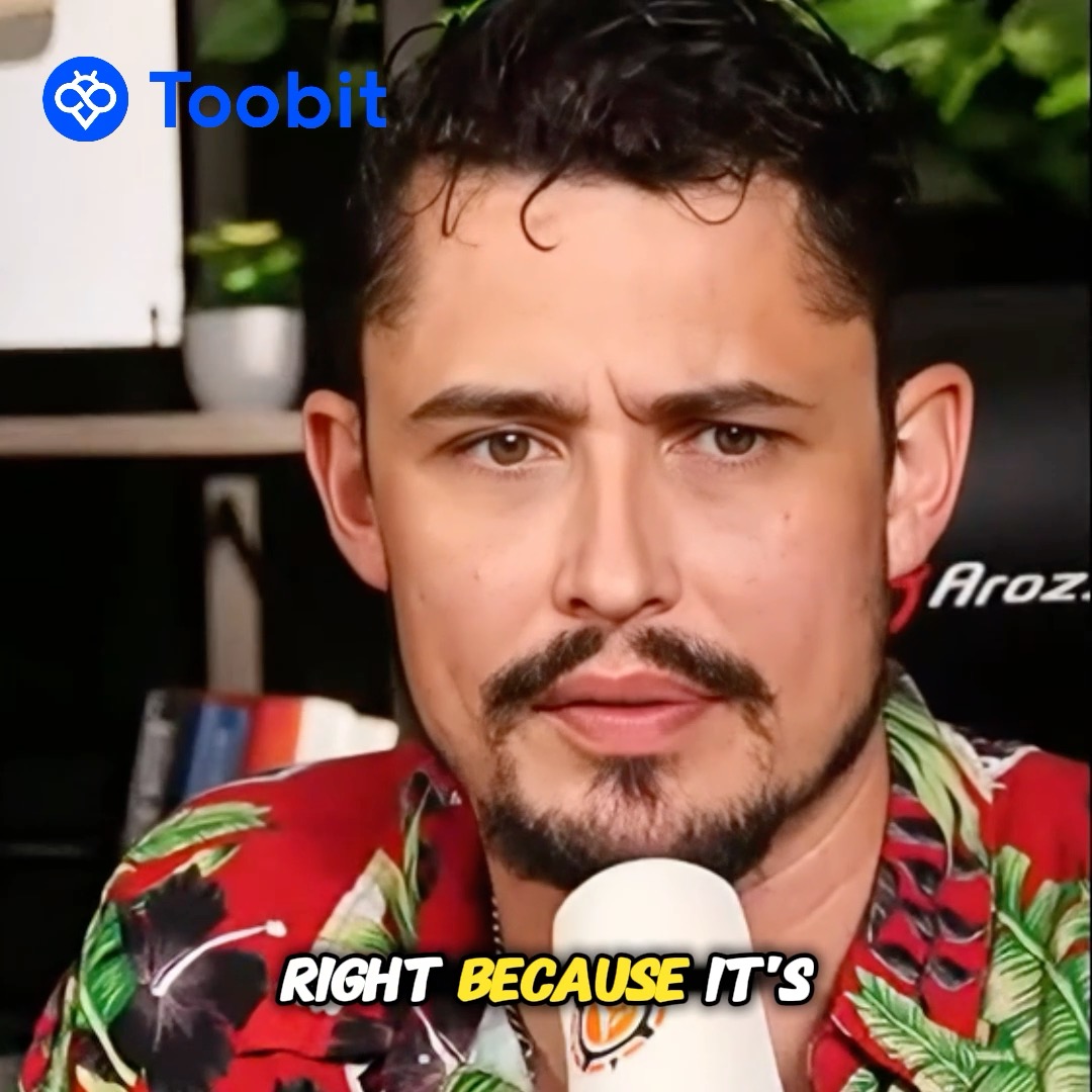 A man in a red floral Hawaiian shirt speaking into a microphone, with the Toobit logo in the upper left corner and subtitle text reading 'RIGHT BECAUSE IT'S'.