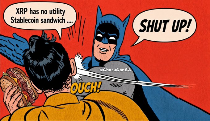A retro comic-style meme shows Batman slapping a man who says "XRP has no utility Stablecoin sandwich..." with Batman responding "SHUT UP!" and the man yelling "OUCH!" — a humorous defense of XRP's utility in payments, tied to Batman Day on September 19th.