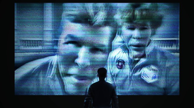 A silhouetted person stands before a large, blue-tinted screen displaying images of Wall Street figures. The scene reinforces the post’s message about exposing Wall Street’s wealth and insider-driven economics through Chainlink, suggesting that time to participate is running out.