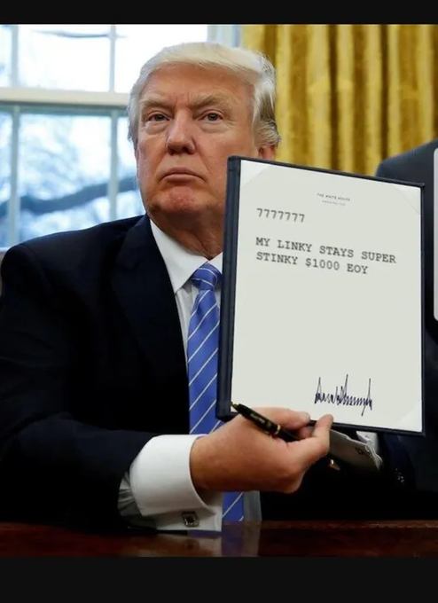 Donald Trump holds a document reading '7777777 / MY LINKY STAYS SUPER STINKY $1000 EOY' signed 'MANASHISH.'