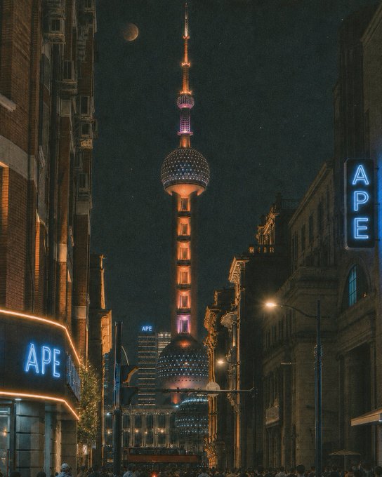 A nighttime view of Shanghai's Oriental Pearl Tower with the moon visible in the sky above, and neon "APE" signs glowing in the foreground, tying the cityscape to the Bored Ape Yacht Club reference. The $APE token branding prominently displayed in the image connects the Shanghai skyline to the crypto's Shanghai-themed promotion.