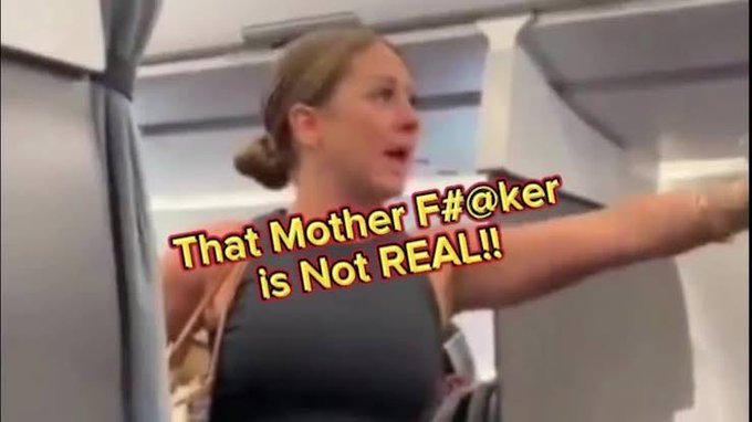 A woman on an airplane angrily points at something off-screen with the overlaid text "That Mother F#@ker is Not REAL!!" The image captures her shocked reaction to the mention of an "$82k sell wall," humorously comparing the surprising cryptocurrency market resistance level to an unbelievable in-flight encounter.