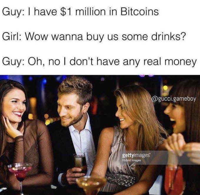 A meme with the text "Guy: I have $1 million in Bitcoins, Girl: Wow wanna buy us some drinks?, Guy: Oh, no I don't have any real money," placed above an image of a man at a bar with two women, credited to @gucci.gameboy and Getty Images.
