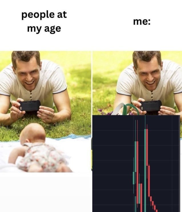 The meme contrasts "people at my age" (left, showing a father photographing his infant) with "me:" (right, showing the same father but covered by a steep downward-trending stock chart in red and green candles), humorously suggesting that while peers are settling down and starting families, the creator is focused on—or devastated by—a crashing stock portfolio, reinforcing the caption "There's still work to do" by implying losses need to be recovered.