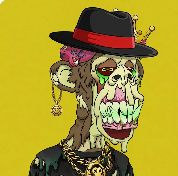 A cartoon zombie ape character wearing a black fedora with a red band, a small crown, gold chains, and X-eyed smiley face medallions dangles from its ear.