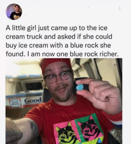 The image features a man wearing a red shirt with cat faces printed on them, holding up an ice cream truck sign or a blue rock she could buy. The caption of the image reads "A little girl just came up to the ice cream truck and asked if she could buy ice cream with a blue rock she found." This post seems to be promoting a product related to ice cream trucks or ice cream, possibly featuring cat faces as part of their branding strategy.
