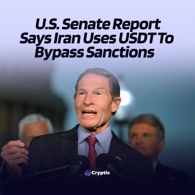 An older man in a suit and red tie speaks at a microphone during what appears to be a press conference, with the headline "U.S. Senate Report Says Iran Uses USDT To Bypass Sanctions" displayed above him and the "Cryptic" logo at the bottom, visually accompanying the post about a Senate report revealing Iran's heavy reliance on Tether's $USDT stablecoin to circumvent sanctions.