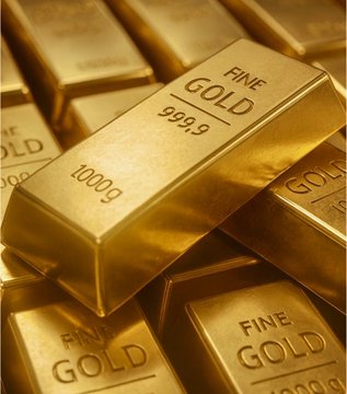 A pile of 1000g fine gold bars stamped with "999.9" purity, symbolizing Tether's massive $18.8 billion gold stockpile following its latest 14-ton purchase.