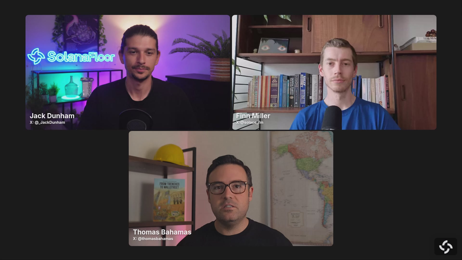 The image shows a group of three men sitting behind computer screens, appearing to be participating in an online meeting or webinar. They are all facing the camera with serious expressions as they engage in the discussion. The background features a map of the world displayed on one screen and a book titled "The SolarFloor" on another screen.