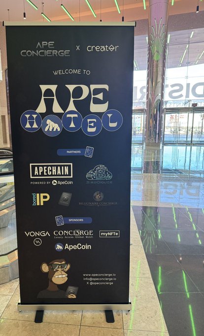 A welcome sign for "Ape Hotel" by APE Concierge x Creator reads "WELCOME TO APE HOTEL," listing partners like ApeChain, Apecin, and Yuga Labs' IP, along with sponsors such as VONGA, Concierge, and myNFT. The image ties to the post's lament about the hotel no longer being available for this year's ApeFest in Charleston, prompting the search for new accommodations for attendees.