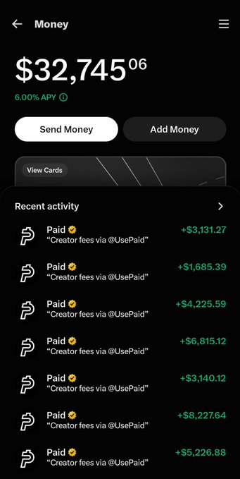 A mobile banking/finance app showing a balance of $32,745.06 with 6.00% APY, featuring Send Money and Add Money buttons, and recent activity showing multiple 'Paid' transactions for 'Creator fees via @UsePaid'.