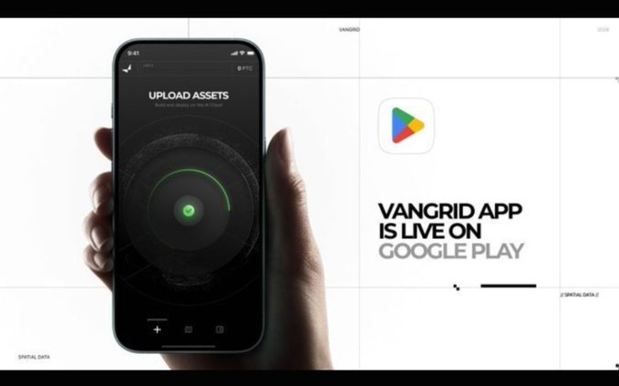 A promotional graphic showing a hand holding a smartphone displaying an 'UPLOAD ASSETS' screen, advertising the Vangrid app now live on Google Play.