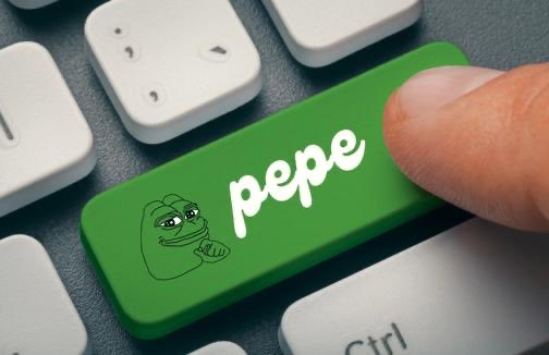 A close-up of a finger pressing a green keyboard key featuring the Pepe the Frog meme character with the word 'pepe' written in white text.